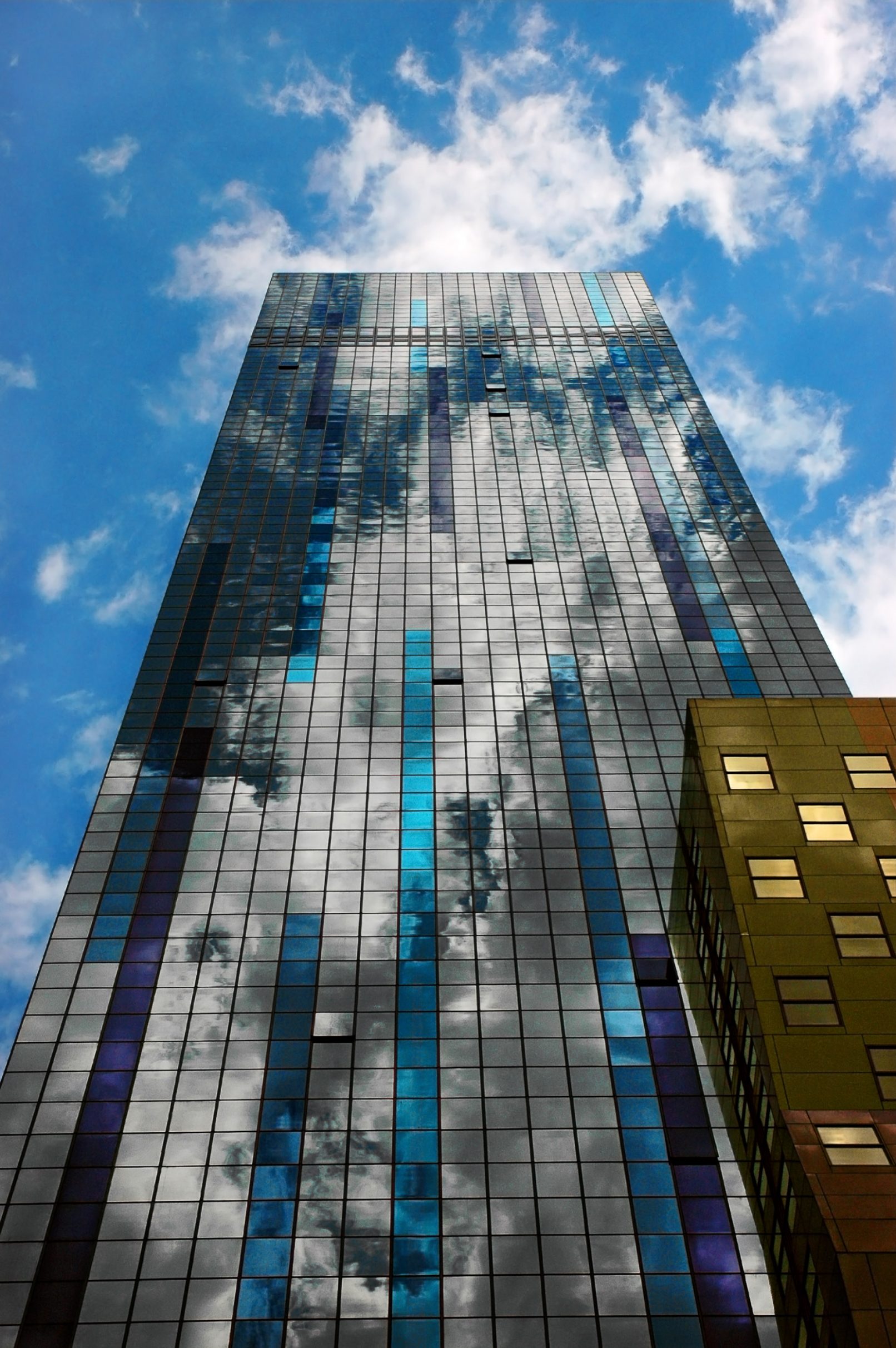 New York City skyscraper with cloud reflections