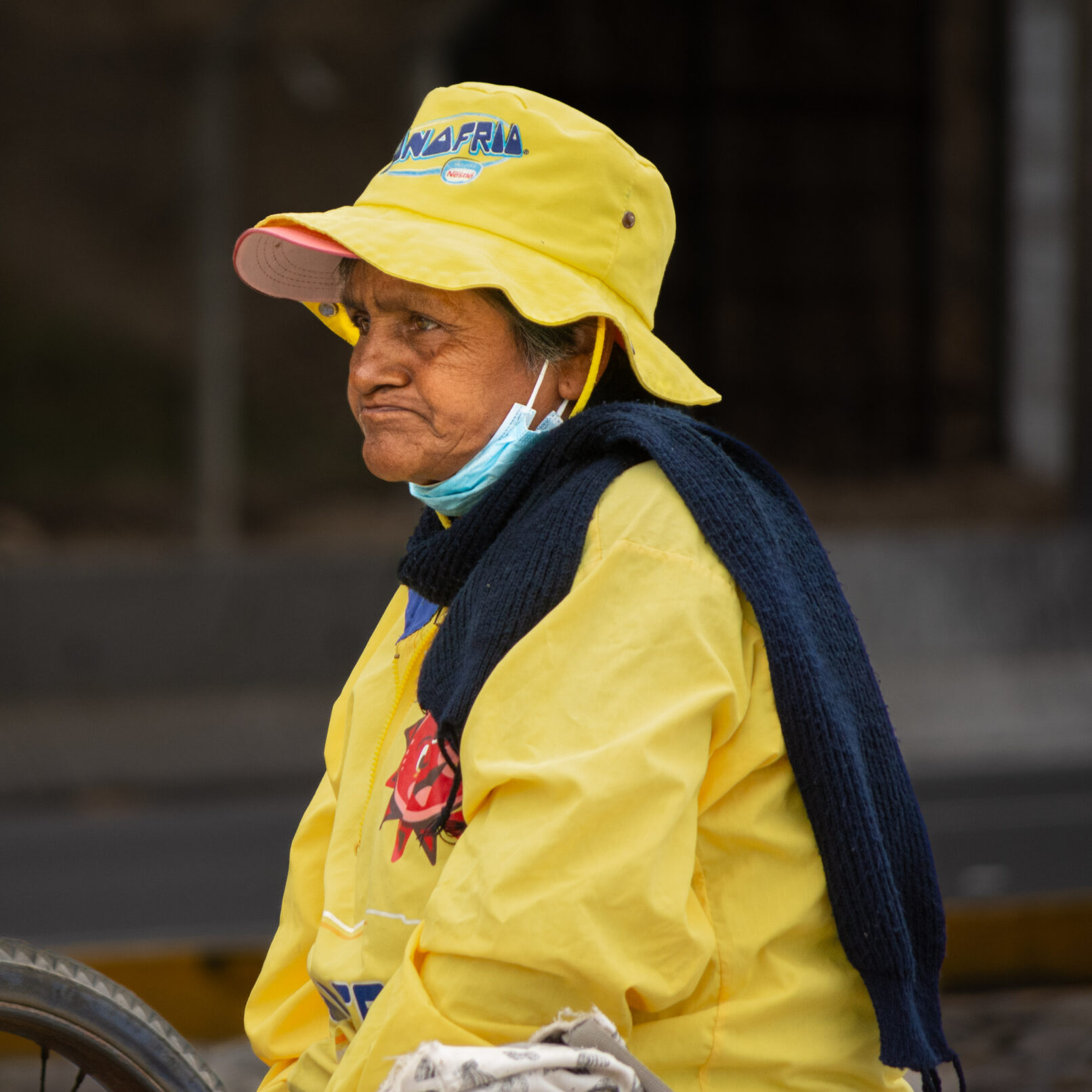 Peruvian woman in yellow jacket