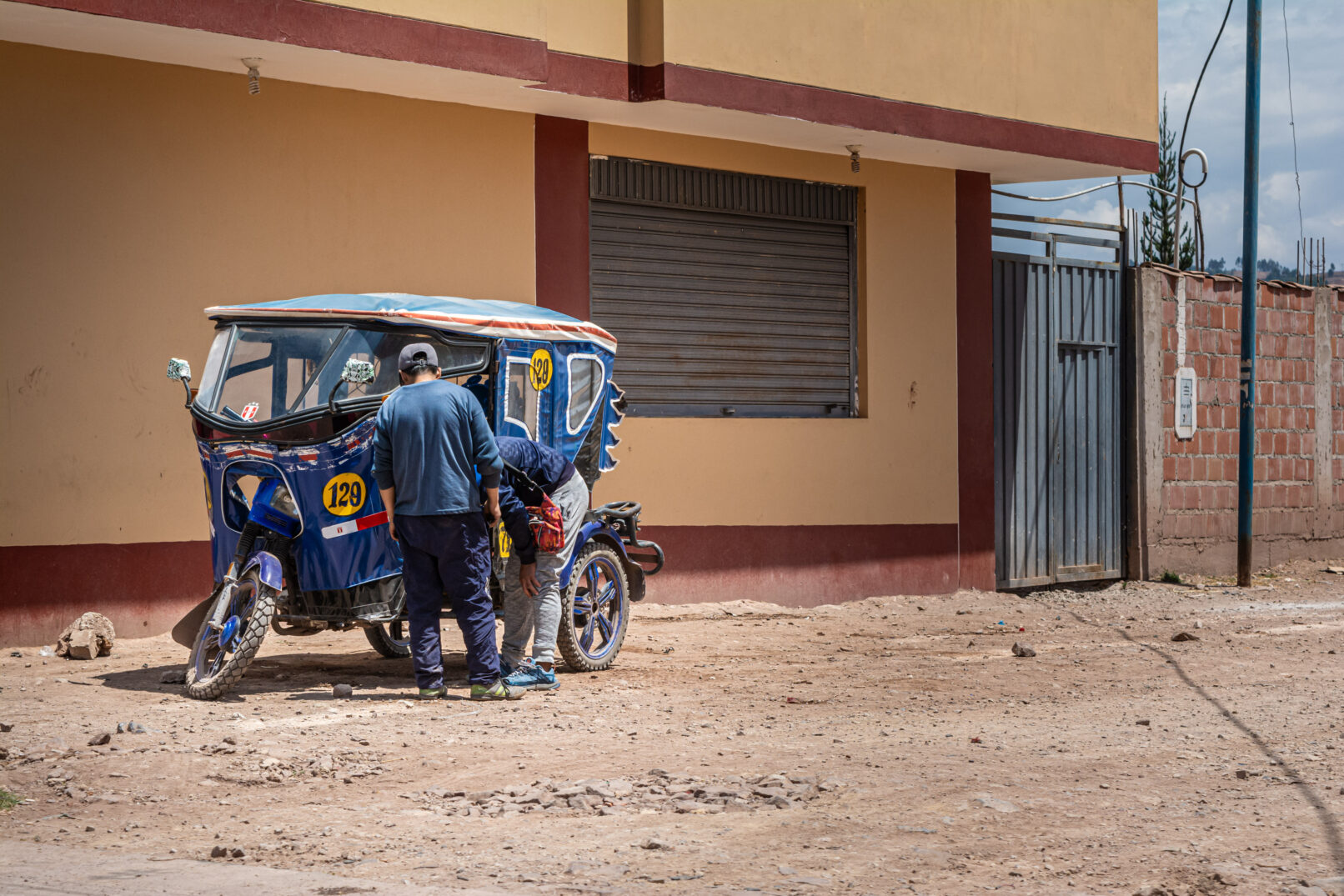 Men and motorcycle, Peru