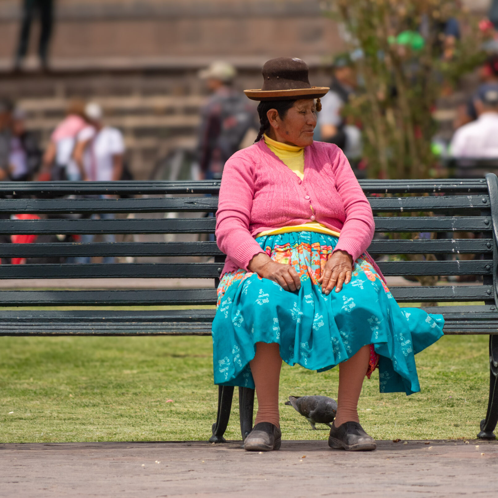 Woman on bench in Cusco, Peru