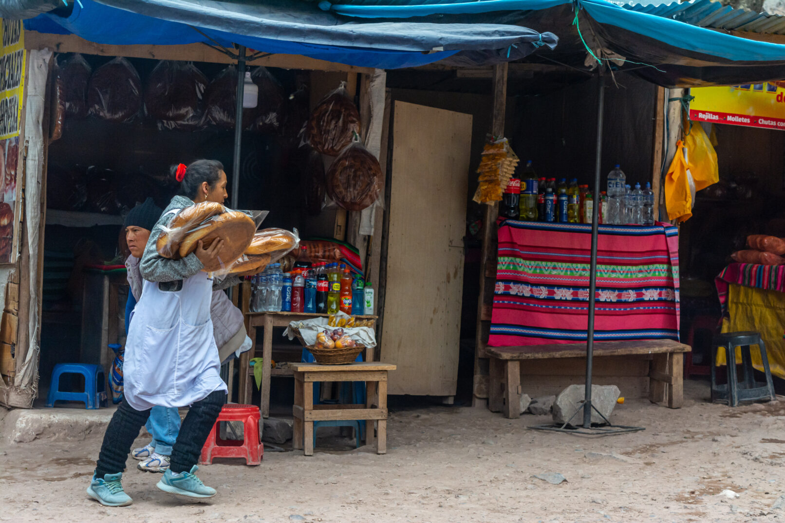 Peruvian woman carrying bread