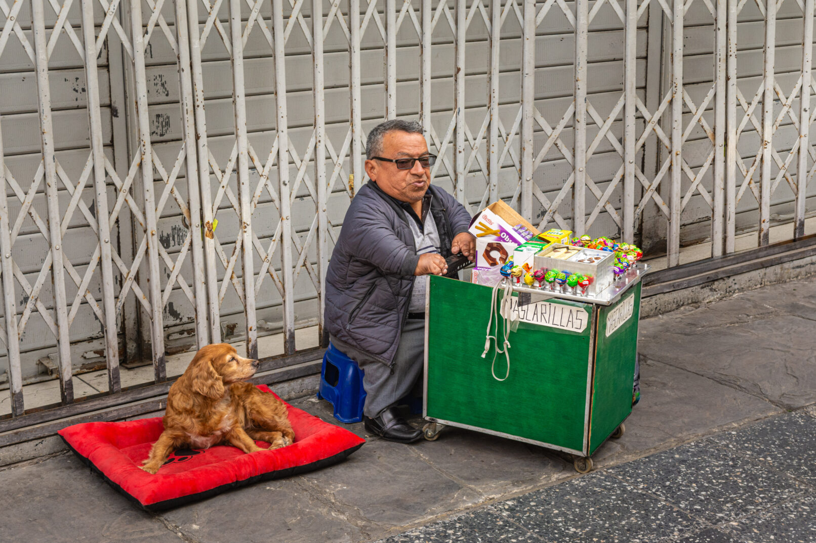 Little Peruvian man on street in Lima, Peru