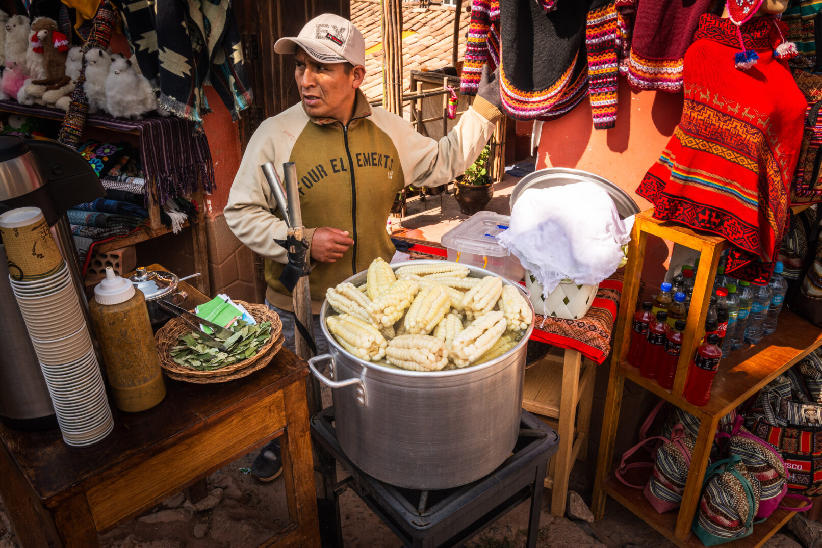 Peruvian man selling corn on street