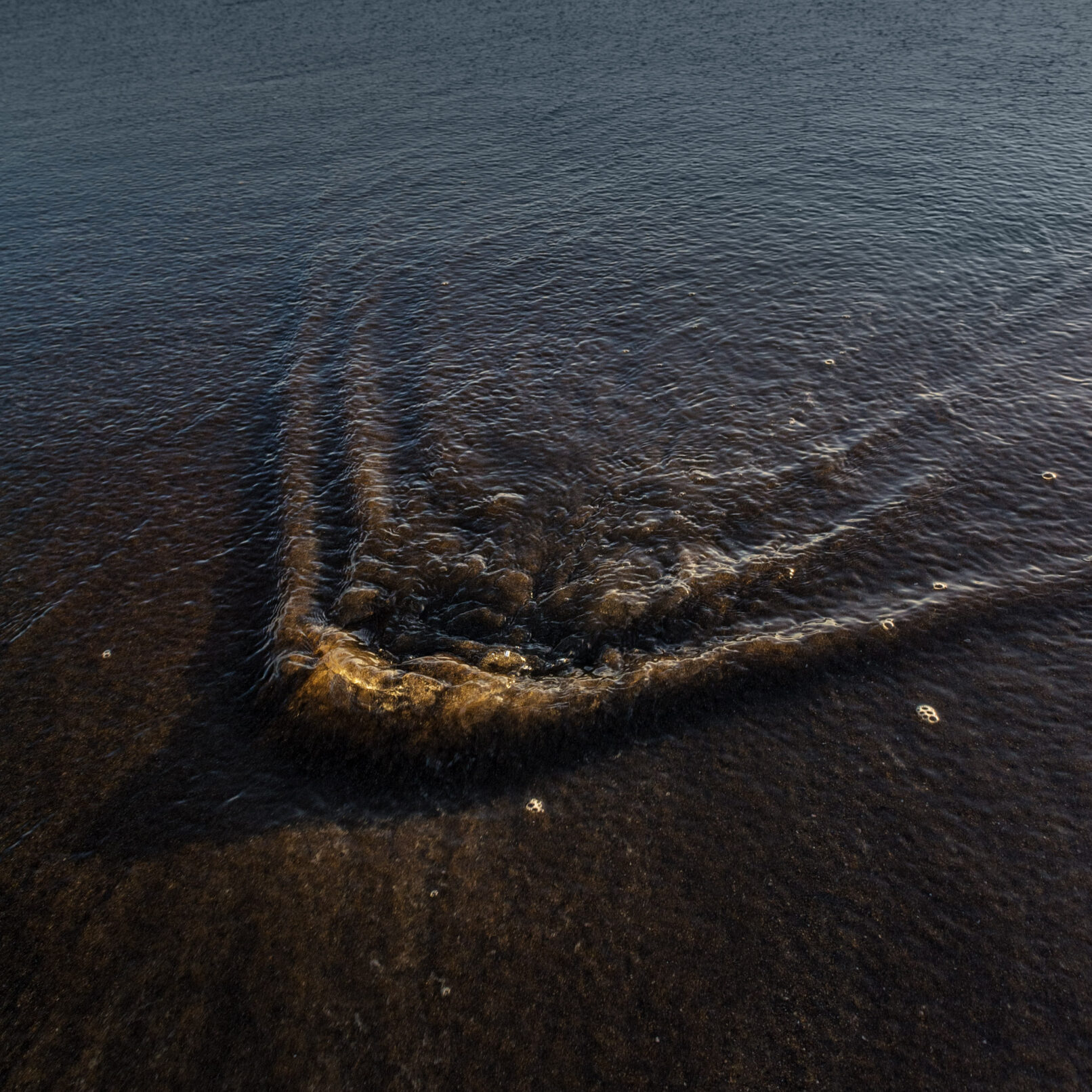 Stone Under Receding Water