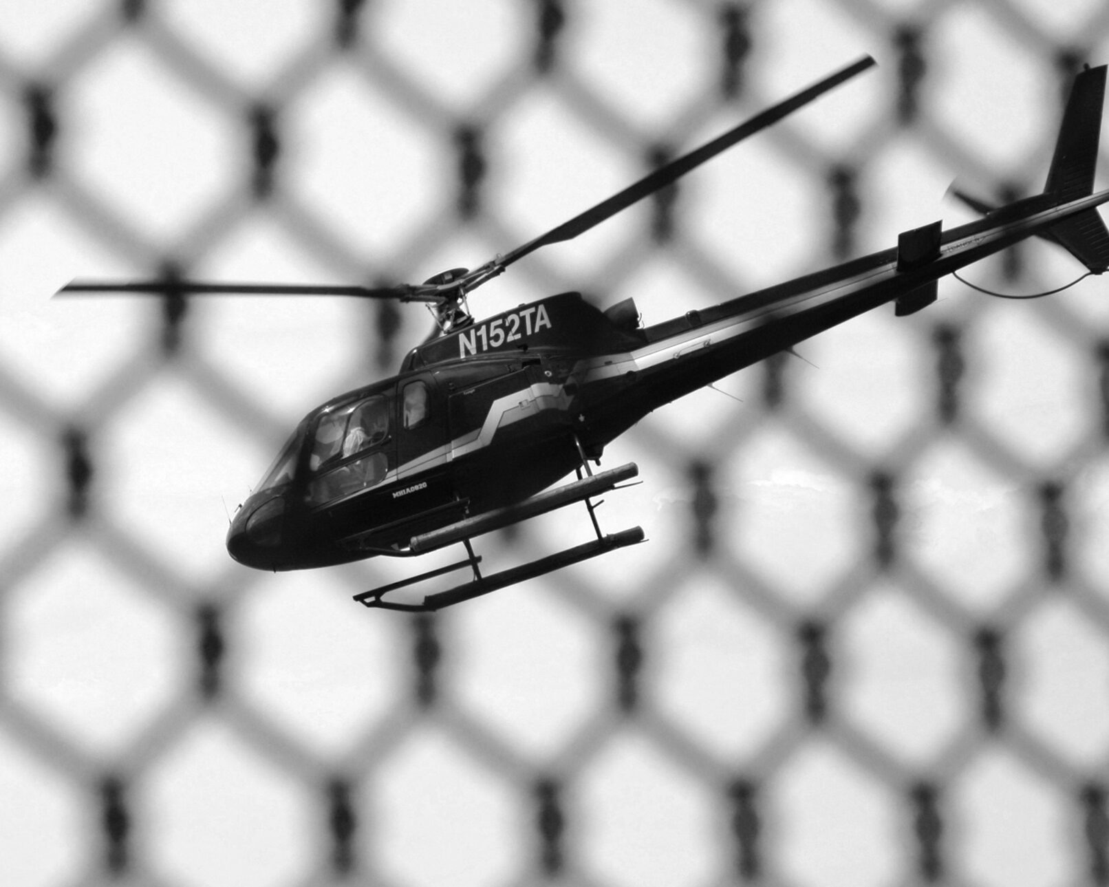 Helicopter through fence.