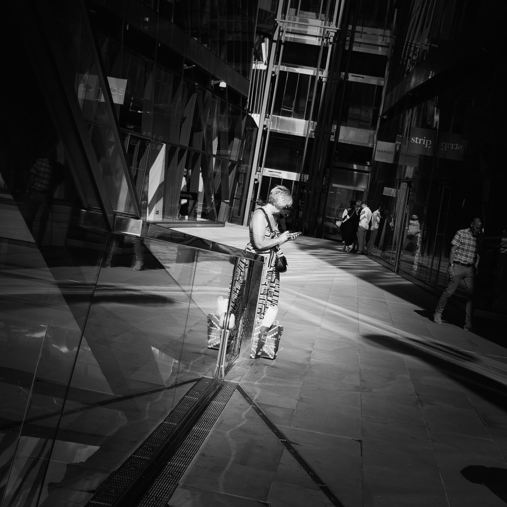 Woman on street with cell phone London