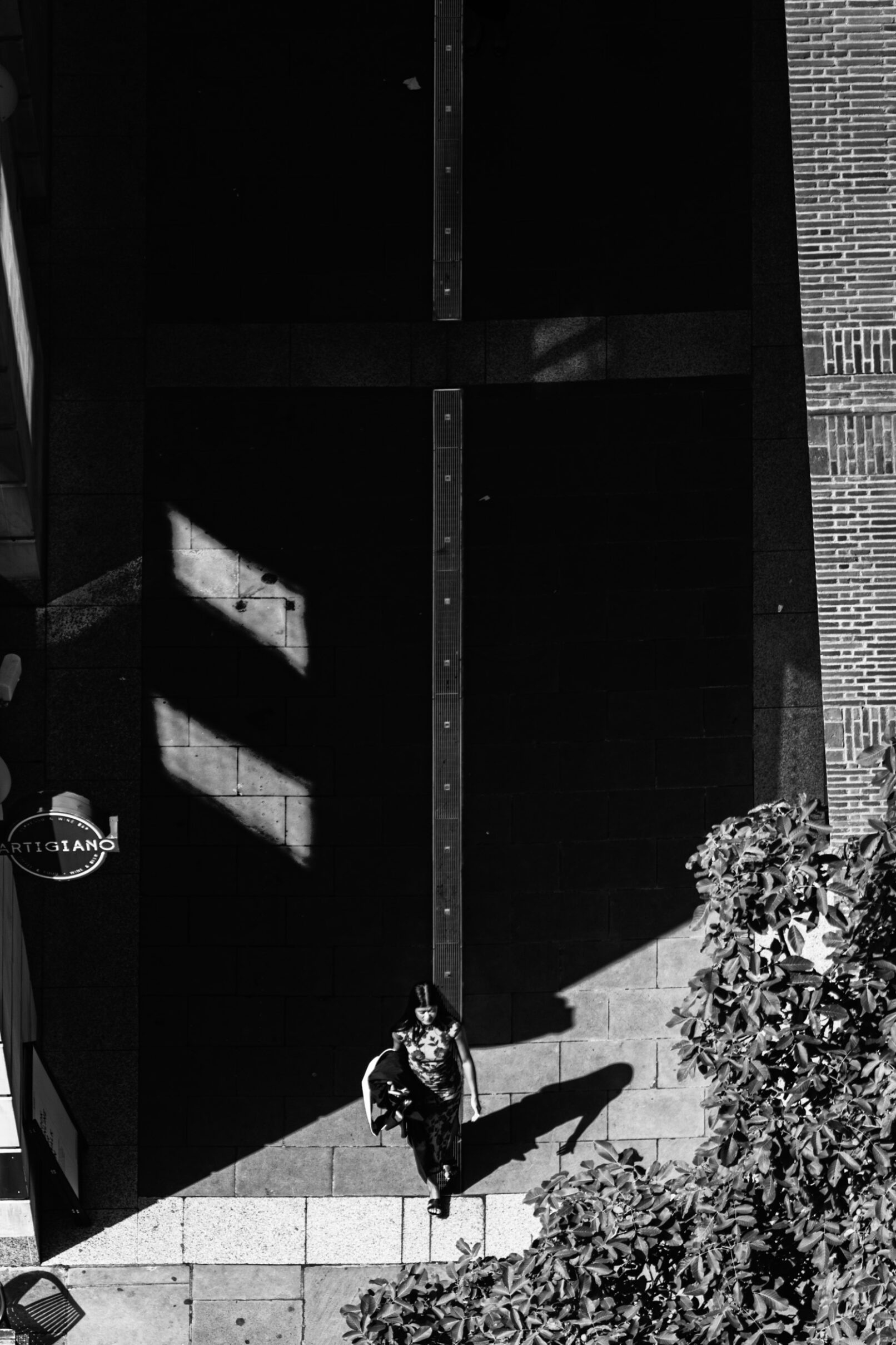 Woman on street from above, London