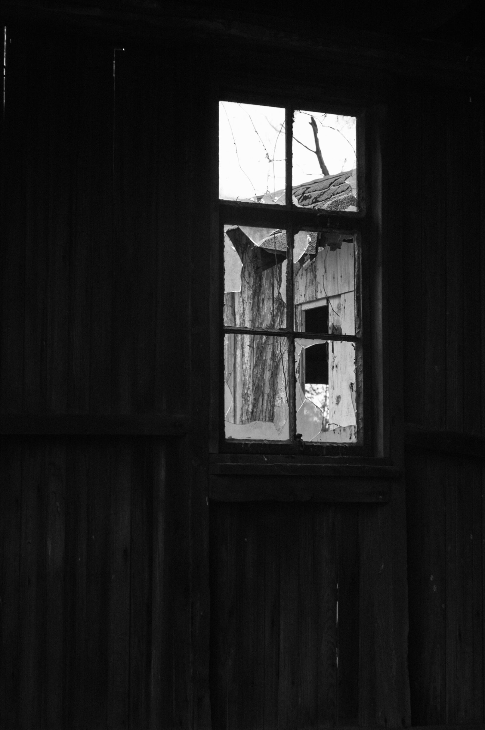 smashed window in old building